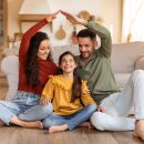 Smiling,Family,Creating,A,Heartwarming,Scene,By,Fashioning,A,House