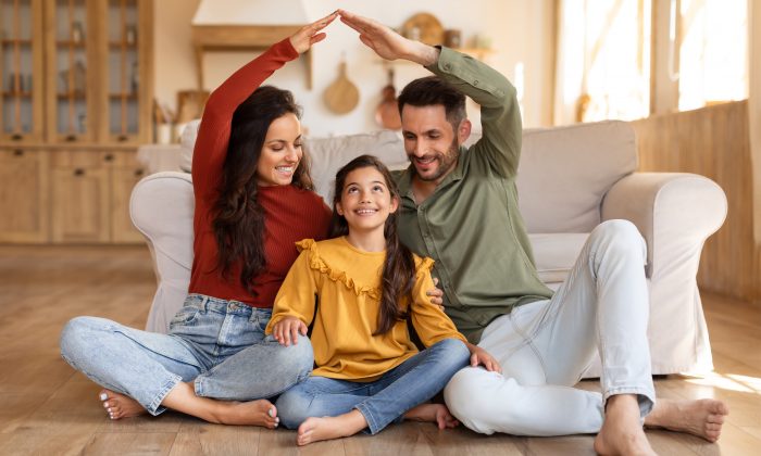 Smiling,Family,Creating,A,Heartwarming,Scene,By,Fashioning,A,House